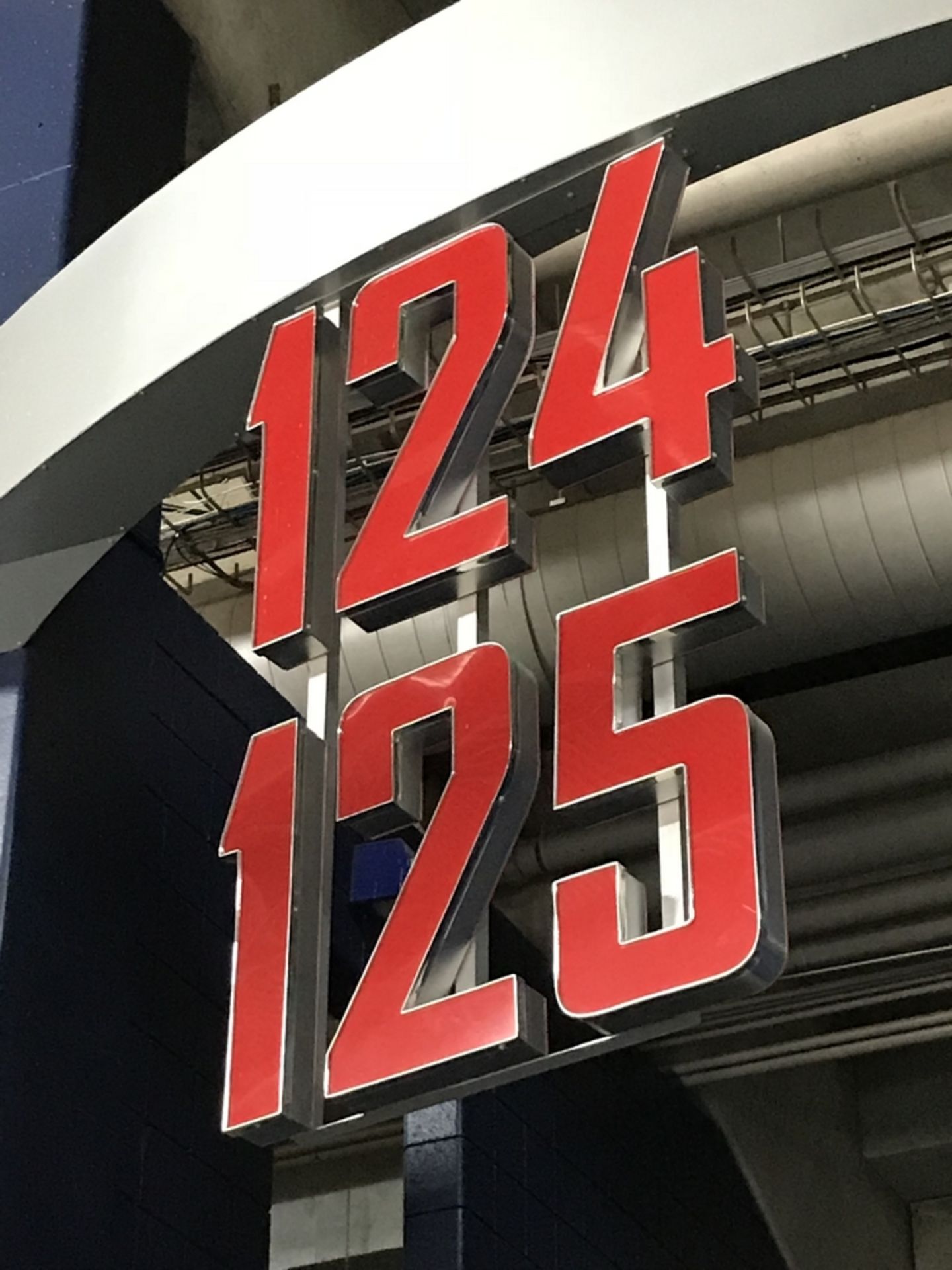 Section Sign Lighted "124-125" , Dim. 42 in x 68 in , Location: Concourse ***Note from