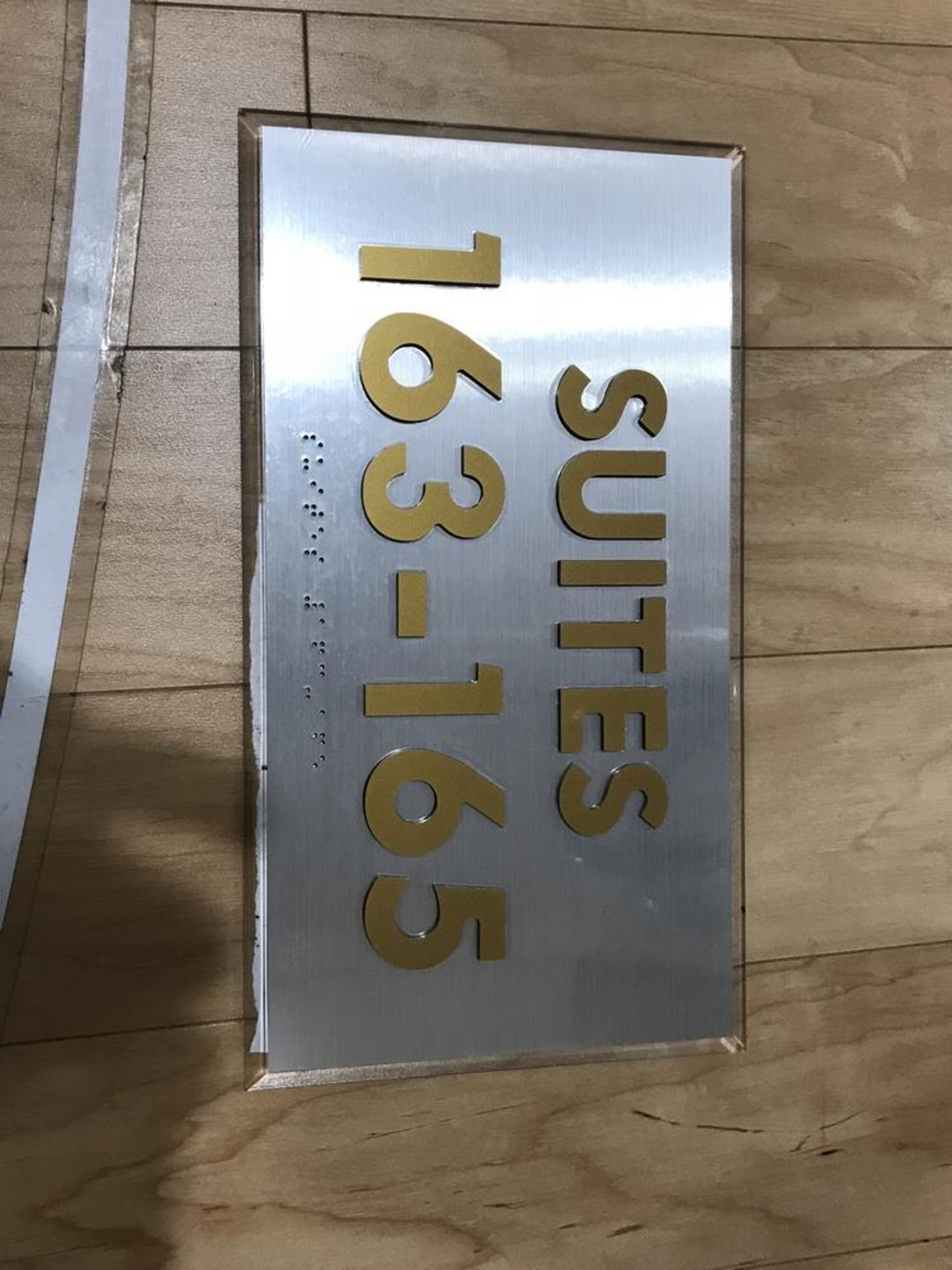 Suites Sign "163-165" , Dim. 12 in x 7 in , Location: Level #100 ***Note from Auctioneer***This