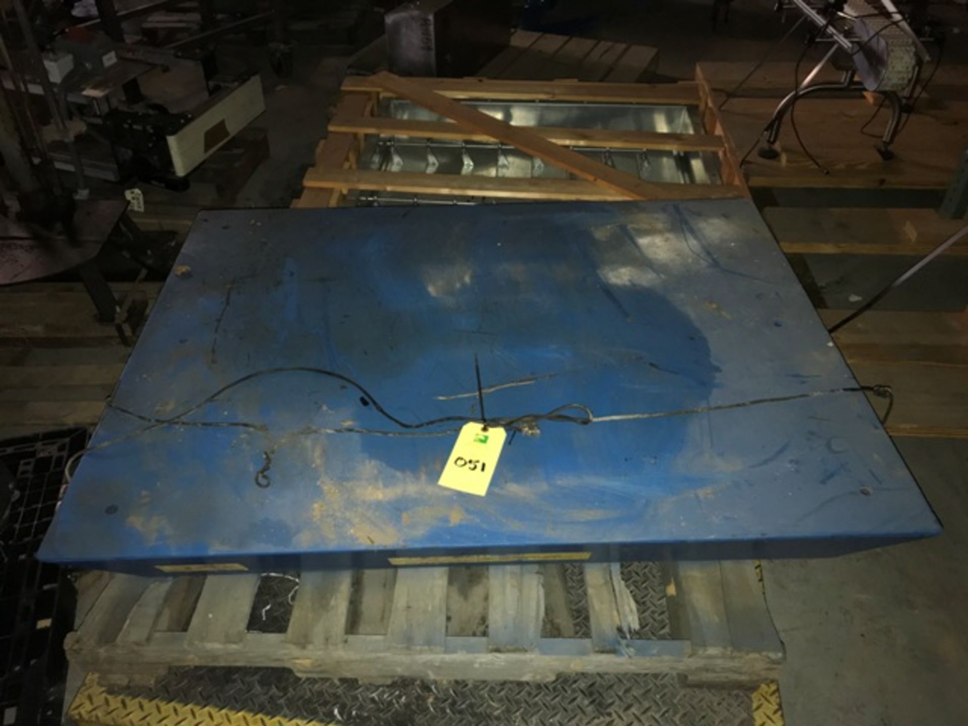 HYDRAULIC LIFT TABLE. 56”L X 42”W PLATFORM. 3000 LBS CAPACITY. MOD# HLT. SER#6091719. 60"L X 48"W