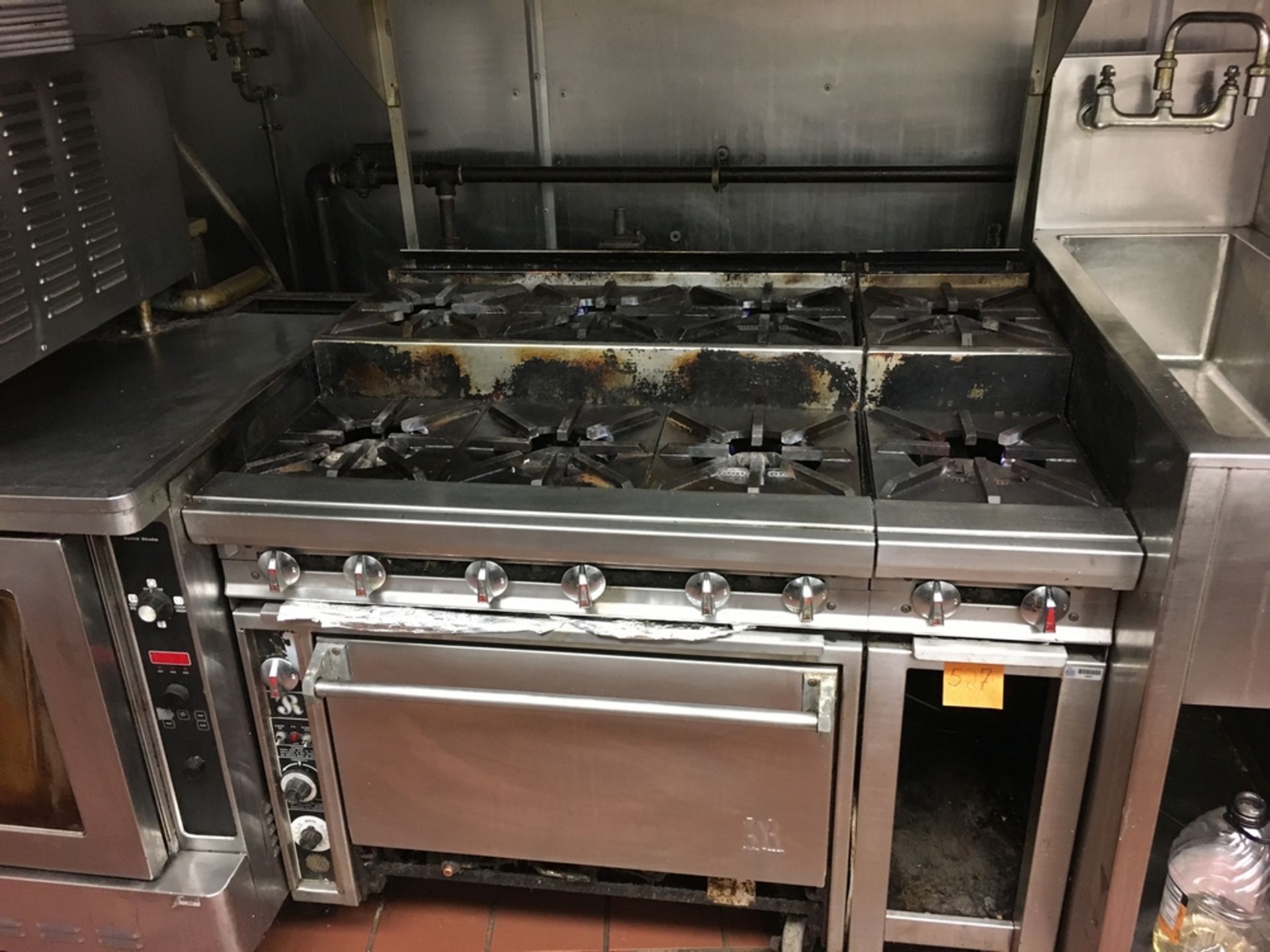 SS Gas Stove, 8-Burner, 4 ft x 3 ft x 5 1/2 f Located: Main Kitchen, adjacent to Palace Grill
