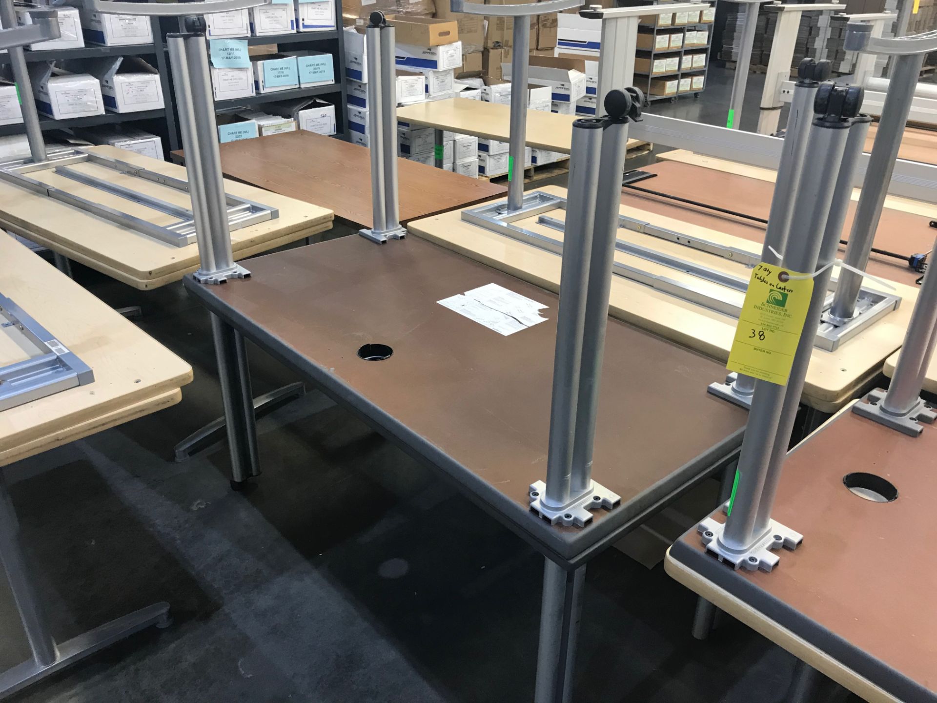 (7) Tables on Casters: 5 ft long x 30 in wide x 27 in tall, Removal Fee: $40