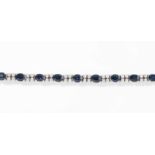 Saphir-Brillant-Bracelet750 Weissgold. 13 oval fac. Saphire ca. 14 ct, 52 Brillanten ca. 1.50 ct.