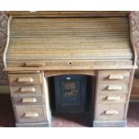 A late 19th Century Oak Rolltop Desk with fully fitted interior. H116cm X W120cm X D68cm.