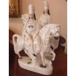 A pair of 19th Century Staffordshire Figures of Men on horseback (1 cracked).