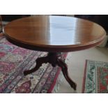 A Victorian Mahogany Circular Table with a tripod base. H69cm X W114cm.