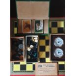 A quantity of Chess and Draught pieces in a box for 'The Dublin Seamens Institute' along with a