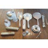 A large quantity of Silver Vanity Items. Various dates and makers. (Held in the cabinet downstairs).