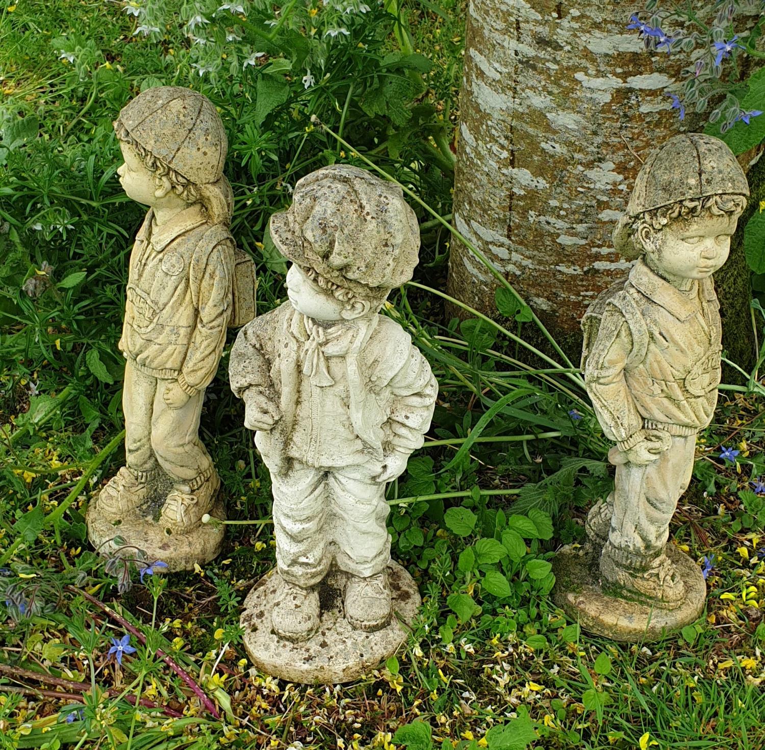 Three Stone Figures of Children.