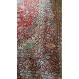 A large Persian Kashan with multi borders and traditional medallion design. L427cm X W294cm.