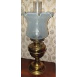 A 19th Century Brass Oil Lamp with a vaseline glass shade. 60cms high.