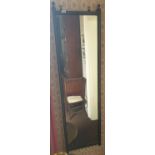 An Edwardian Ebonised Mirror. 152 h x 43 w cms.