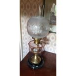 A 19th Century Oil Lamp with a pink glass bowl. Lamp H58cm.