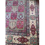 A very large hand knotted Rug with square centre decoration and multi borders. L416cm X W290cm.