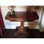 A good 19th Century Mahogany Foldover Card Table with a central shaft on a platform base. Circa