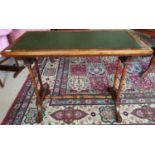 A fantastic 19th Century Walnut Writing Table with a green tooled leather top on turned supports.