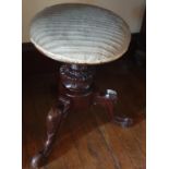 A 19th Century Revolving Piano Stool.