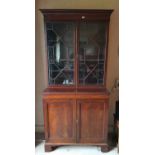 A Regency Mahogany two door Bookcase of neat proportions with astragal glazed upper section and