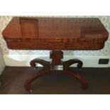 A really good Regency Mahogany Foldover Card Table with an edged support on an platform base.