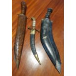 A Kukri along with two other knives.