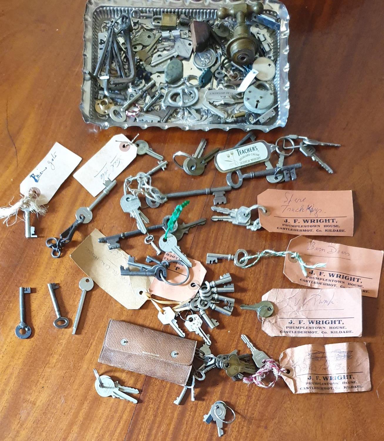 A quantity of Vintage Keys on a Silver Plated Tray.