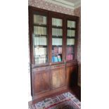 A late Georgian Regency Mahogany alcove three door Bookcase with roped edge detail, roped edge