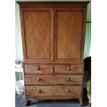 A Regency Mahogany Gentleman's Wardrobe with twin panel top and a drawered base. H200cm X W123cm X