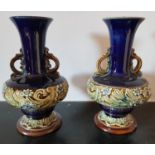 A pair of Doulton Stoneware vases along with a Beswick Toby Jug and other items.