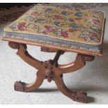 A 19th Century Walnut X frame Stool with a Tapestry seat.