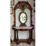 A Victorian Mahogany arch topped Hall/Hat Stand with a serpentine fronted marble top. W120cm X