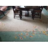 A good large Oriental style Rug with leaf and floral decoration on a cream and green ground. 496 x