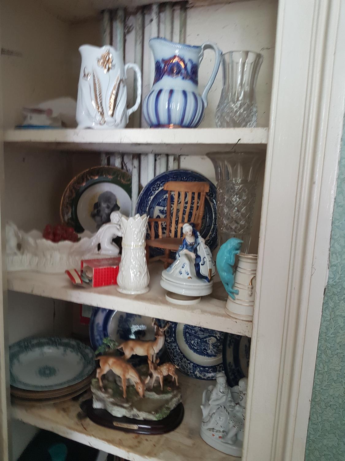 A quantity of Vintage Items in cabinet.