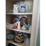 A quantity of Vintage Items in cabinet.