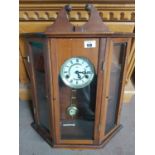 A Modern Clock in a Cabinet along with a pair of Edwardian Mahogany Panels.