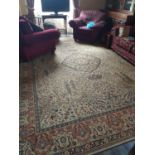 A large Cream ground Rug with multi borders and allover decoration (slight wear in centre). 416 x