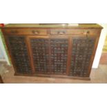 A large 19th Century Walnut Court Cupboard with a three drawer top and profusely moulded doors.