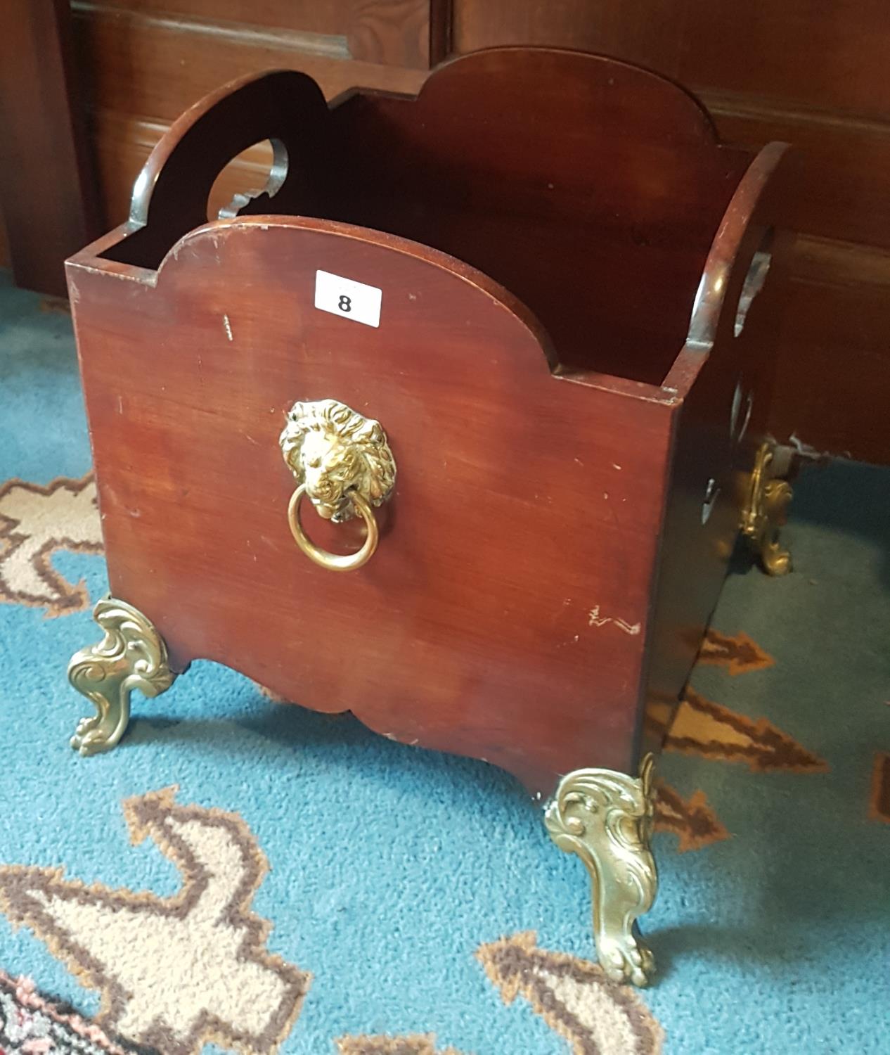 A lovely 19th Century Mahogany Wine Cooler (lacking liner) with brass feet and lions ring handles.
