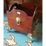 A lovely 19th Century Mahogany Wine Cooler (lacking liner) with brass feet and lions ring handles.