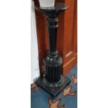 A 19th Century ebonised Stand with turned and reeded pillar. H 99cm.