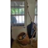 Two Wicker Baskets along with a tree sculpture as a hat rack.