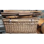 A large Wicker Laundry Basket along with a military seat.