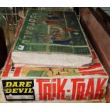 A vintage Trix Trax by Tri-ang made in Northern Ireland along with a vintage tin football game.