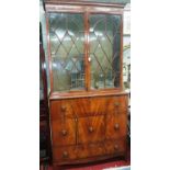 A superb Regency Mahogany Inlaid Bookcase with astragal glazed doors and lions head handles.