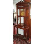 A 19th Century Mahogany Hall Stand with a mirror back and lift up lid. W 66 H 187cm.