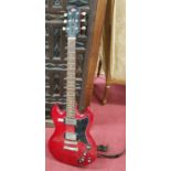 A Gibson SG style six string electric guitar by Coxx SD Special with cherry red body with black