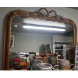 A Victorian Mahogany 3/4 Arch top Mirror with a rope edge decoration.