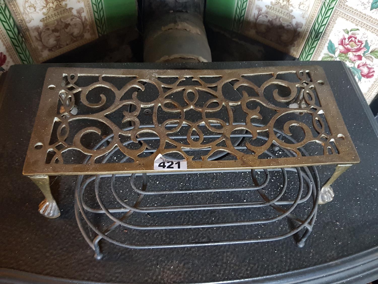 A 19th Century Brass Coal Bucket along a trivet and other items.