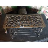 A 19th Century Brass Coal Bucket along a trivet and other items.