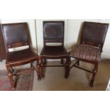 Three early 20th Century Oak Chairs with original leather seats.