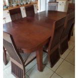 A large early 20th Century Dining Table with one leaf. Will take at least three more leaves.