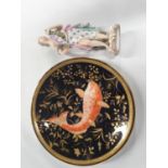 A Royal Crown Derby Plate with hand painted decoration along with a porcelain Figure.